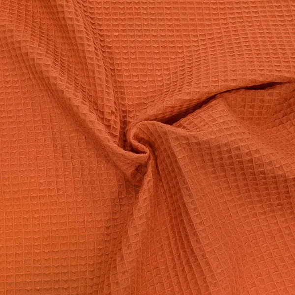 Tissu uni aspect nid d'abeille 230g/m² RUCHE pur coton orange flamingo